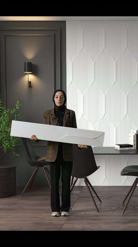 Dekoratif panel yatay çevrilerek modern ofis ortamında geniş yüzeyi gösteriliyor.