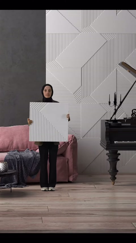 Dekoratif kare panel, pembe koltuklu iç mekânda önden gösteriliyor